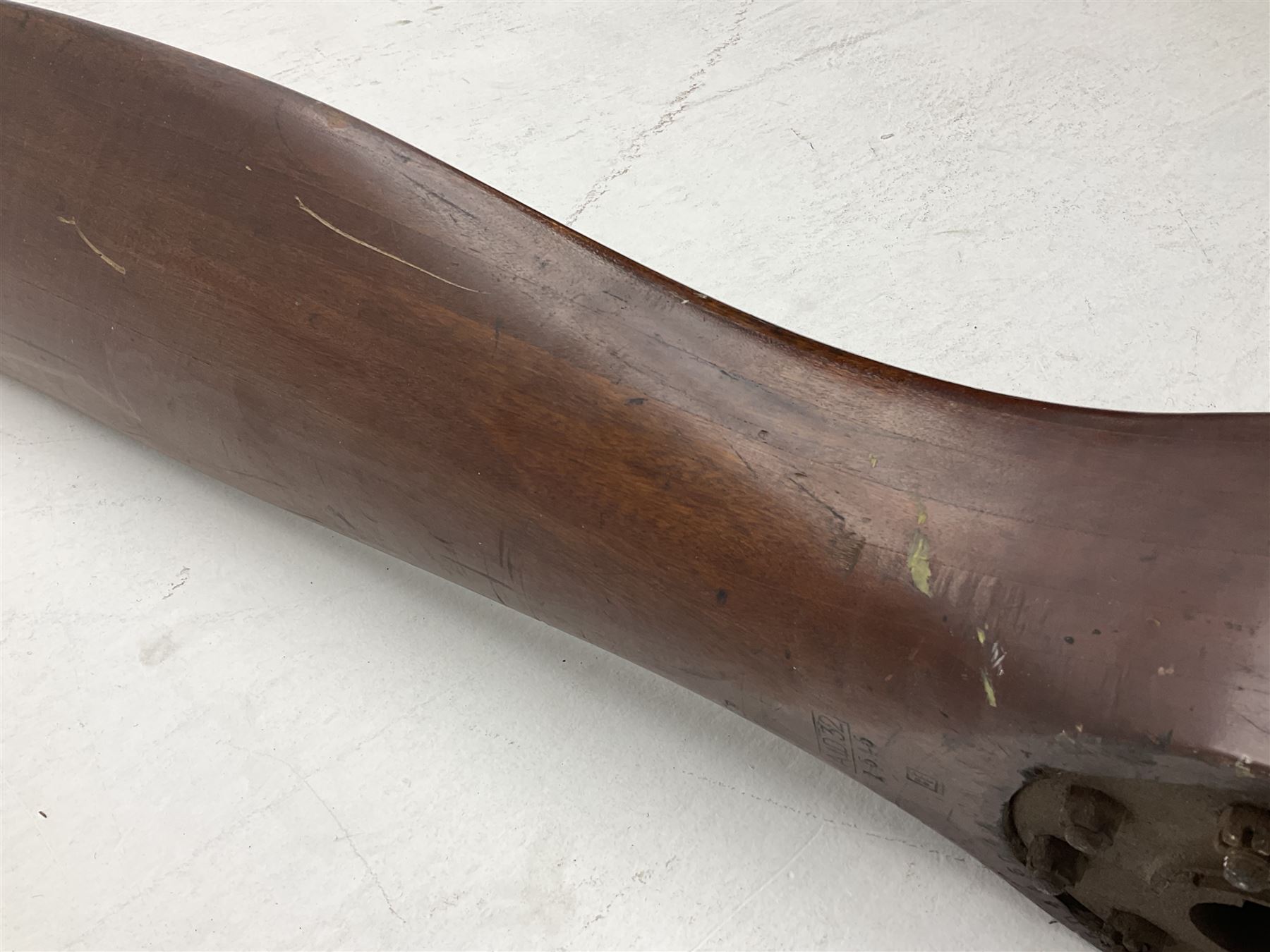 Early 20th century Avro 504 80HP Gnome laminated mahogany two-blade propeller with metal centre to the hub, stamped to the face of the hub 'AVRO Y80 80HP GNOME TYPE 504 & 504A A.I.D.29 A.I.D.32 1545' and to the sides of the hub '2744 DIA 1829 PITCH' and '1470'; traces of A.V. Roe & Co Ltd Manchester transfers to both blades L273.8cm; Auctioneer's Note: The Avro 504 was introduced in 1913 and was quickly taken up by the Royal Flying Corps as a trainer and observation machine; robust and versatile it remained in general service as a trainer until the late 1920s then widely for civilian use as a joy-rider and for stunt displays. The legendary RAF WWII ace, Douglas Bader, took instructions and would have had his first solo flight in just such a machine.