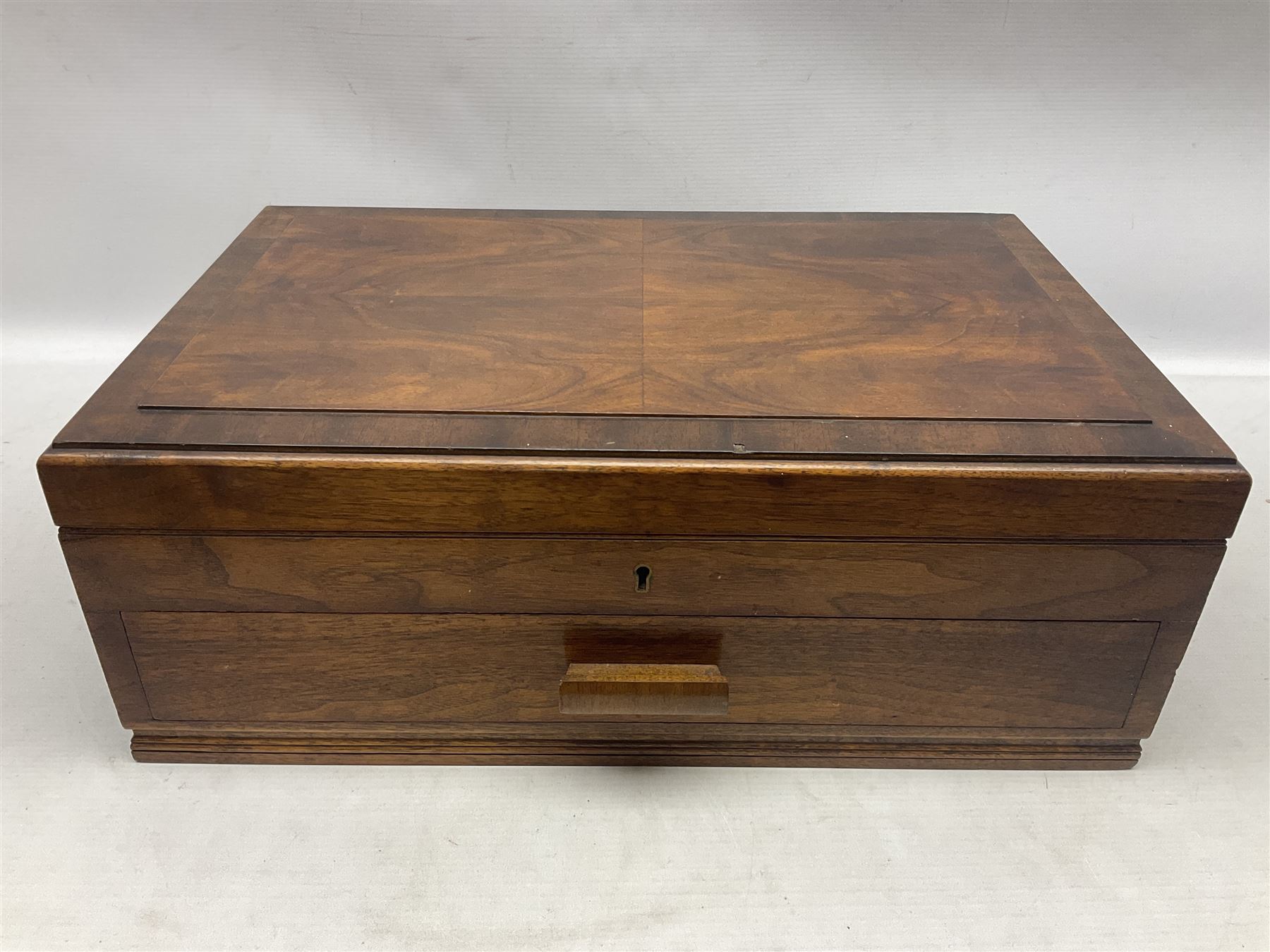 Elkington & Co part canteen of silver plated and stainless steel cutlery, to include simulated ivory handled examples, housed in oak and mahogany case, lock plate stamped 'Acme, British Made', W49cm D31cm H18cm