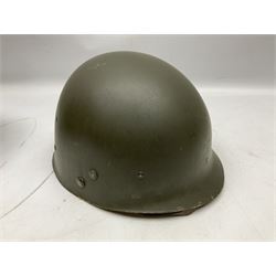American first type paratrooper helmet with post-WW2 strap and D-rings and later 1944 liner bearing Firestone Tyre and Rubber Company mark; green textured finish
