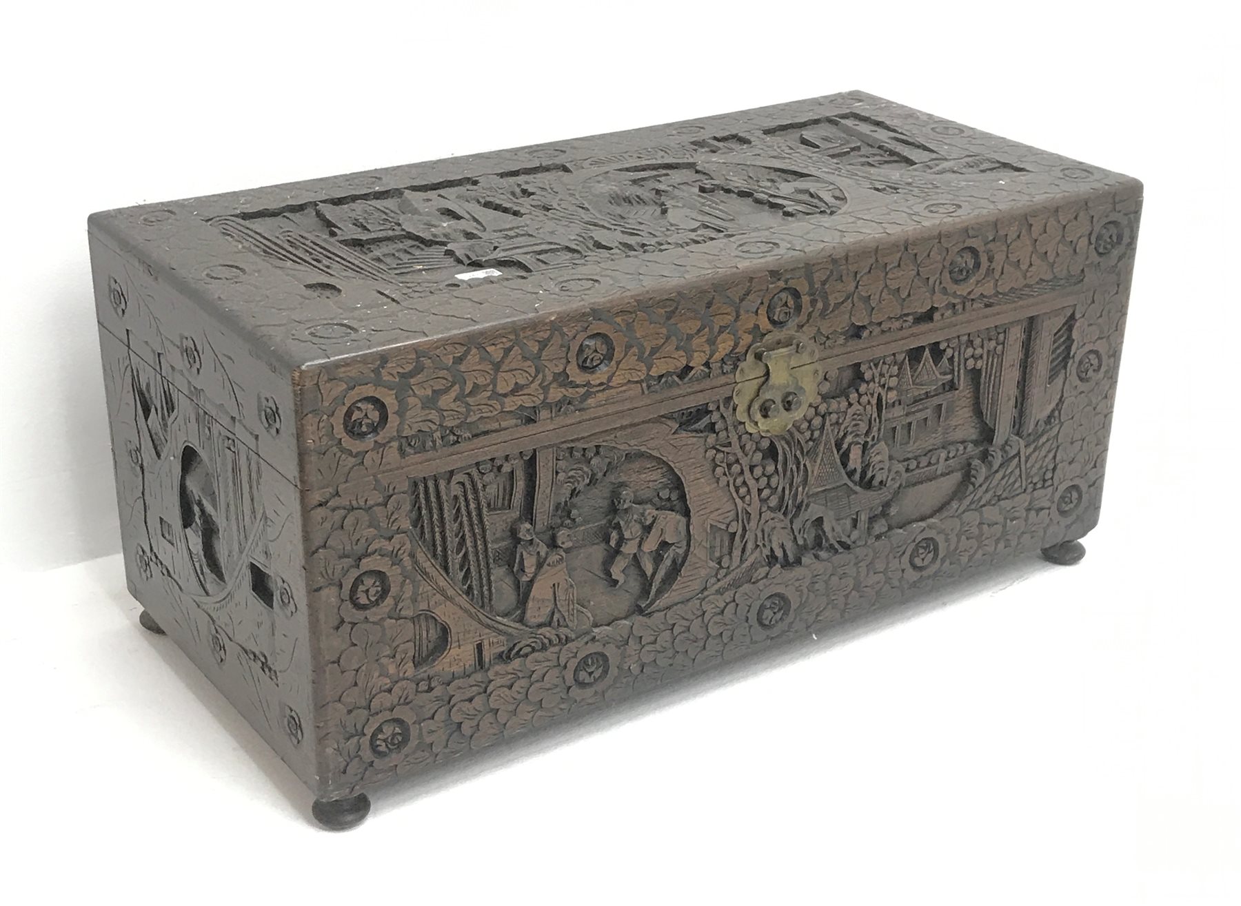 Eastern carved camphor wood blanket box depicting urban scene, W94cm, H49cm, D45cm   