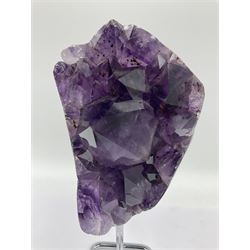 Amethyst crystal geode cluster, with large well-defined crystals, upon a metal stand, H21cm