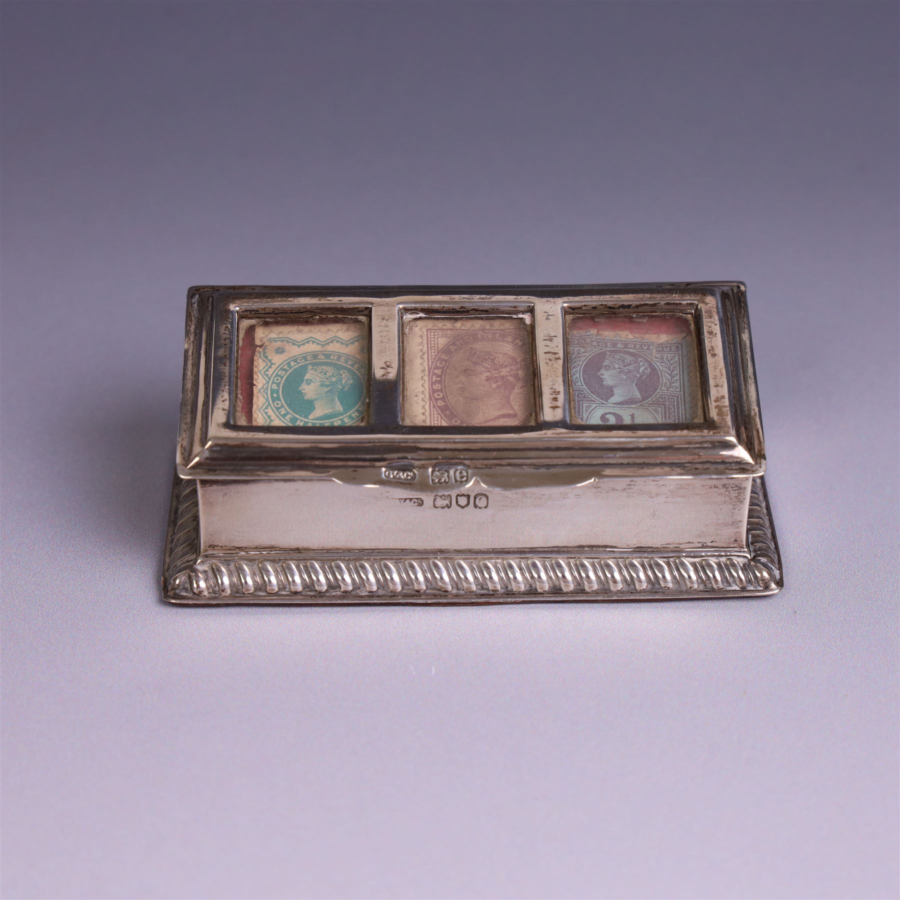 Late Victorian silver mounted stamp box, the hinged lid with three glazed panels, hallmarked Grey & Co, London 1900, together with a late Victorian silver hair comb and a cased set of six silver coffee spoons