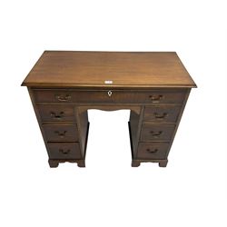 Georgian design twin pedestal kneehole desk, rectangular top with moulded edges over single frieze drawer and knee drawer, pedestals fitted with three drawers on each side, raised on bracket feet

This item has been registered for sale under Section 10 of the APHA Ivory Act 
