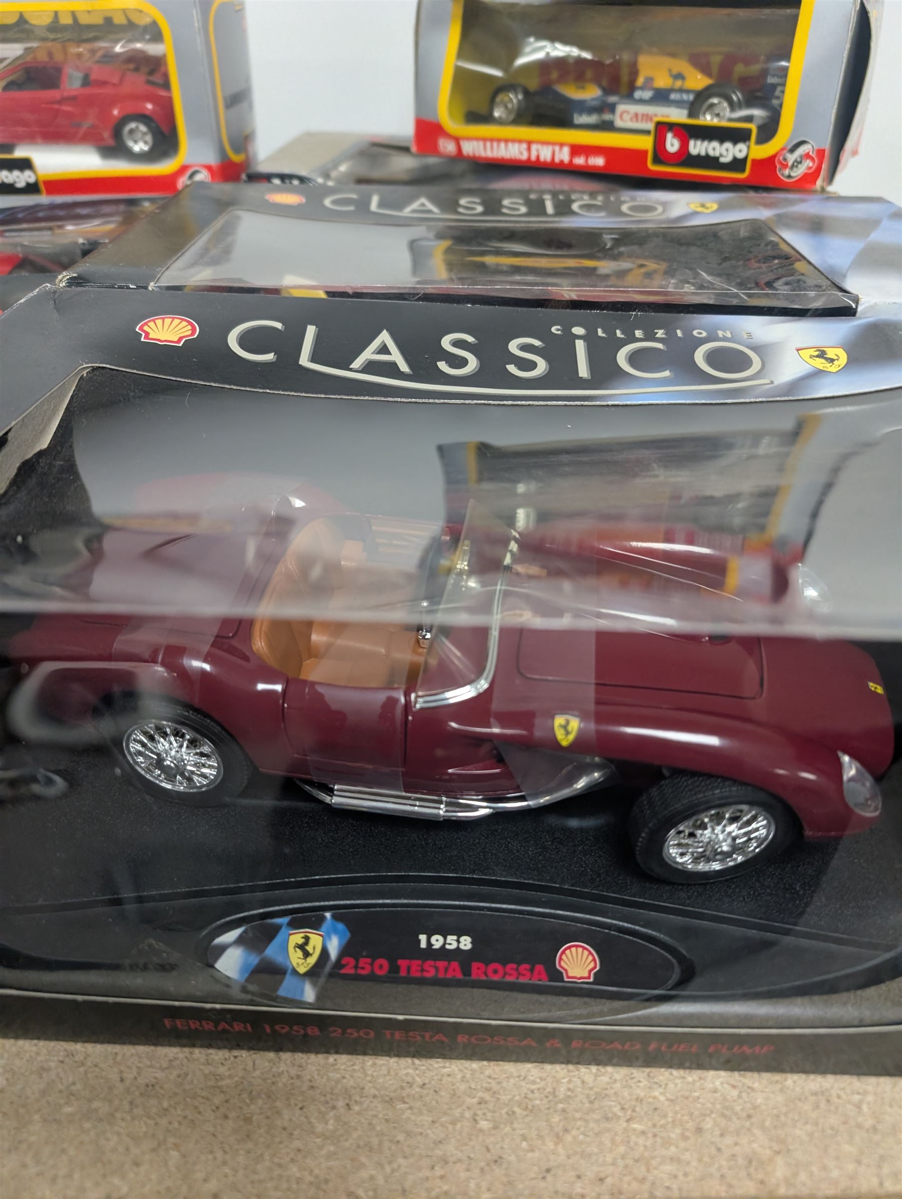 Fourteen 1:18 and 1:24 scale diecast model vehicles, including Classico Ferrari 1972 312, DX RC Lamborghini Gallardo, Maisto Silver Edition Porsche Boxter, , Bburago Williams Fw14, Bburago Ferrari 641/2, etc all boxed