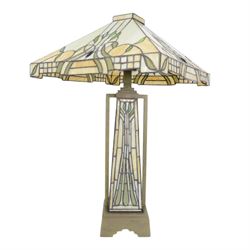 Tiffany style table lamp, the tapering stem and stepped pyramid shade, with naturalistic green foliate decoration on a cream ground, including shade H67cm