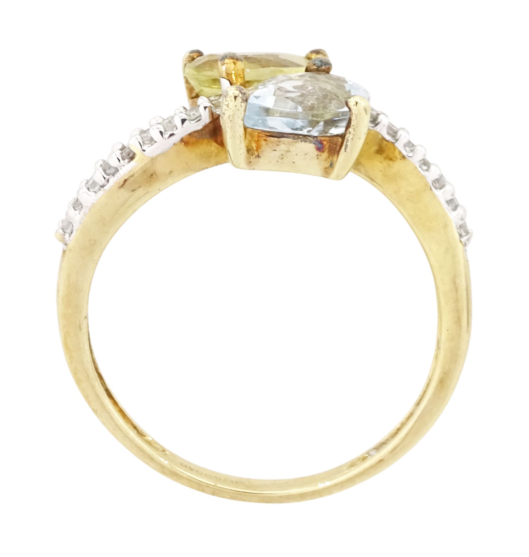 9ct white gold quartz, aquamarine and diamond crossover ring, single pear cut aquamarine and yellow / green quartz, with diamond set shoulders, Birmingham 2004