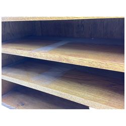 Craftsman made oak magazine table or HI-FI stand, moulded rectangular top over four shelves, flanked by two projecting holders