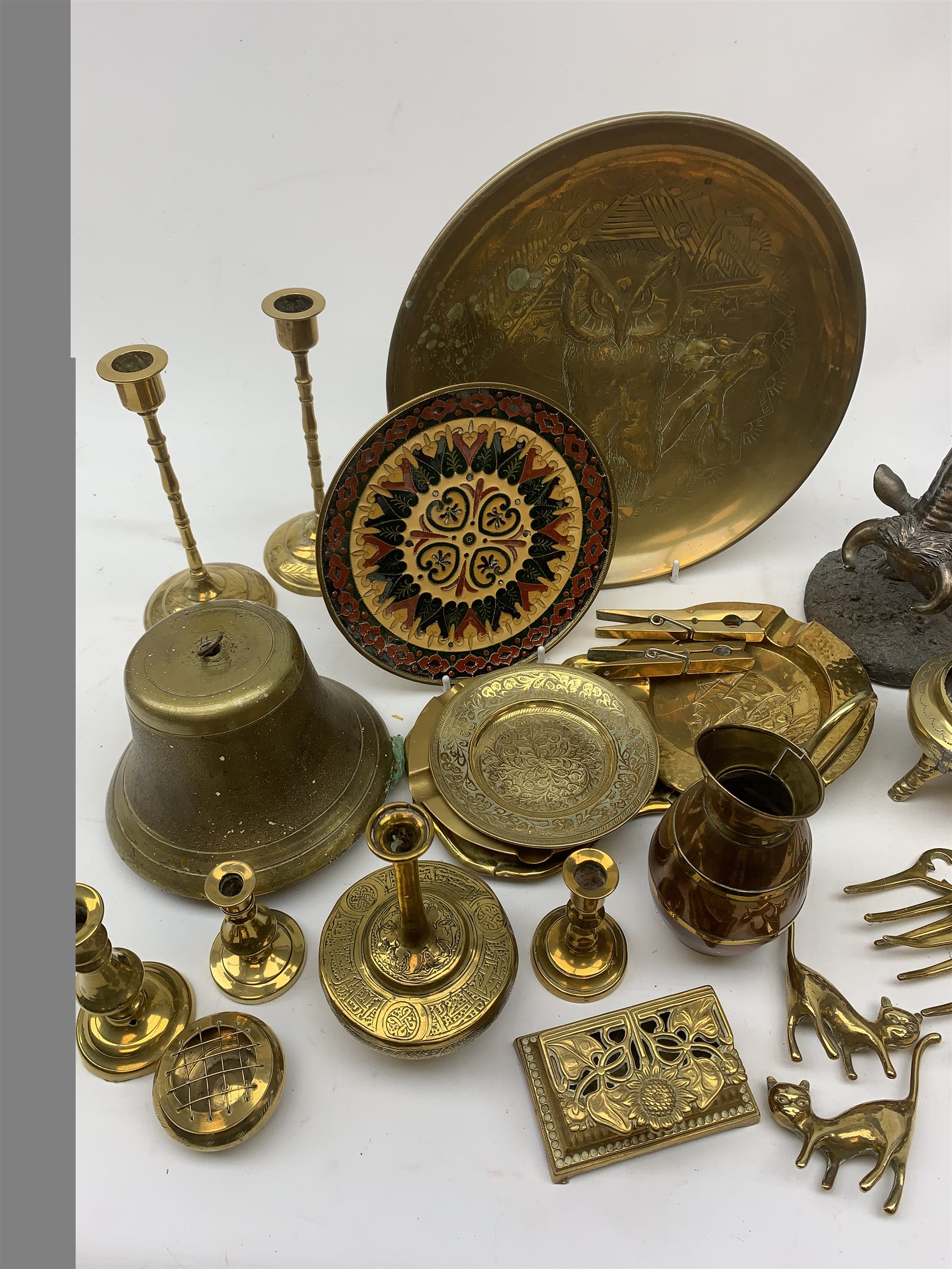 A collection of brassware, to include candlesticks, dishes, toasting