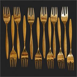 Extensive suite of WMF 800 silver gilt cutlery, for twelve covers, comprising twelve table knives and forks, fish knives and forks, dessert forks, table spoons, dessert spoons, teaspoons, eleven dessert forks and six serving spoons, with crescent moon and crown WMF hallmarks