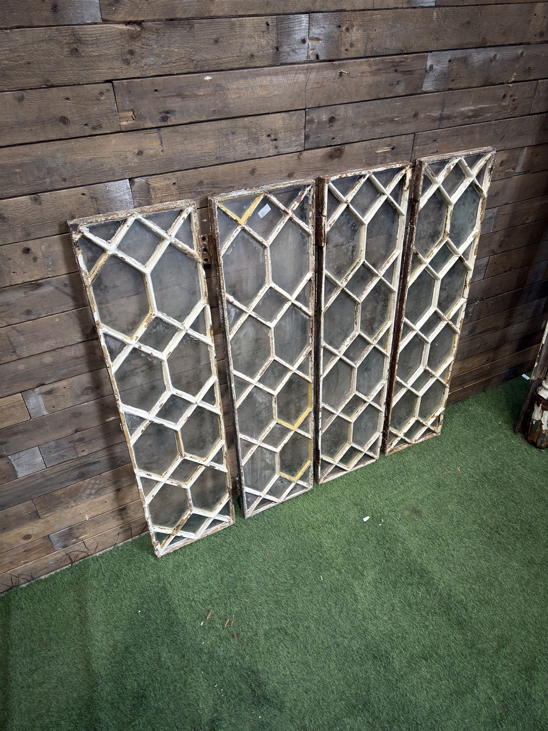 Four 19th century cast iron windows, lattice glazed in white painted finish, 