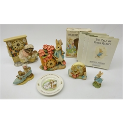  The World of Beatrix Potter - Border Fine Arts Peter Rabbit Clock, Mrs Tiggywinkle Clock, Peter Rabbit Running, Mrs Rabbit, Peter, Flopsy, Mopsy & Cotton Tail clock, Wedgwood dish, book set and Old Woman In Shoe figure, all but one in original boxes (7)  