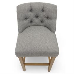 Contemporary set of three upholstered bar stools, each with button-tufted grey fabric backrest and seat, raised on light oak finish square legs united by stretchers