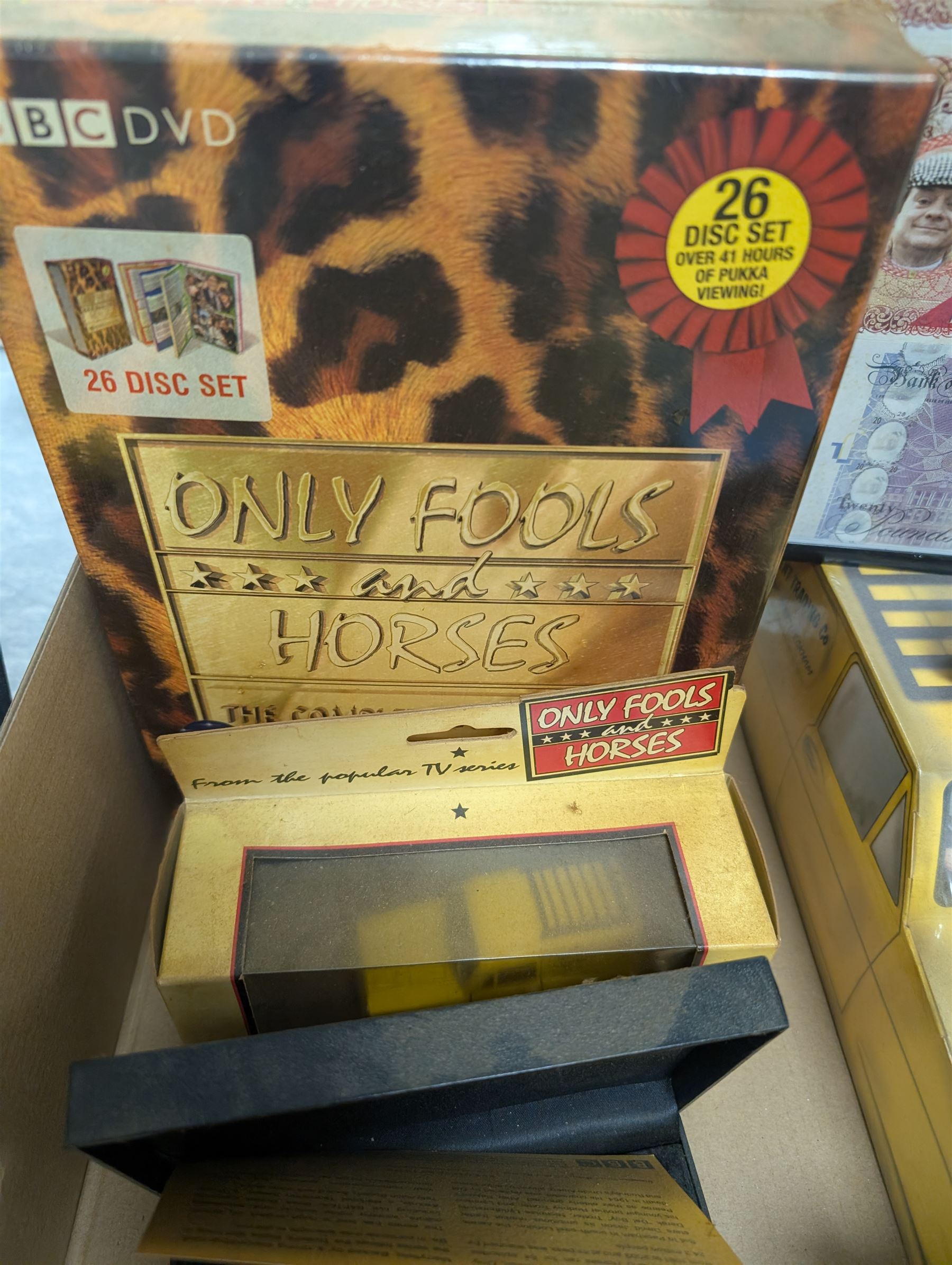 Collection of Only Fools and Horses memorabilia, including Westminster Mint limited edition fifty pence coin set, DVD box set, Corgi Reliant Regal, playing cards, framed bank notes, Griffin Cartoon of the bar scene, etc, together with a Vicar of Dibley DVD box set