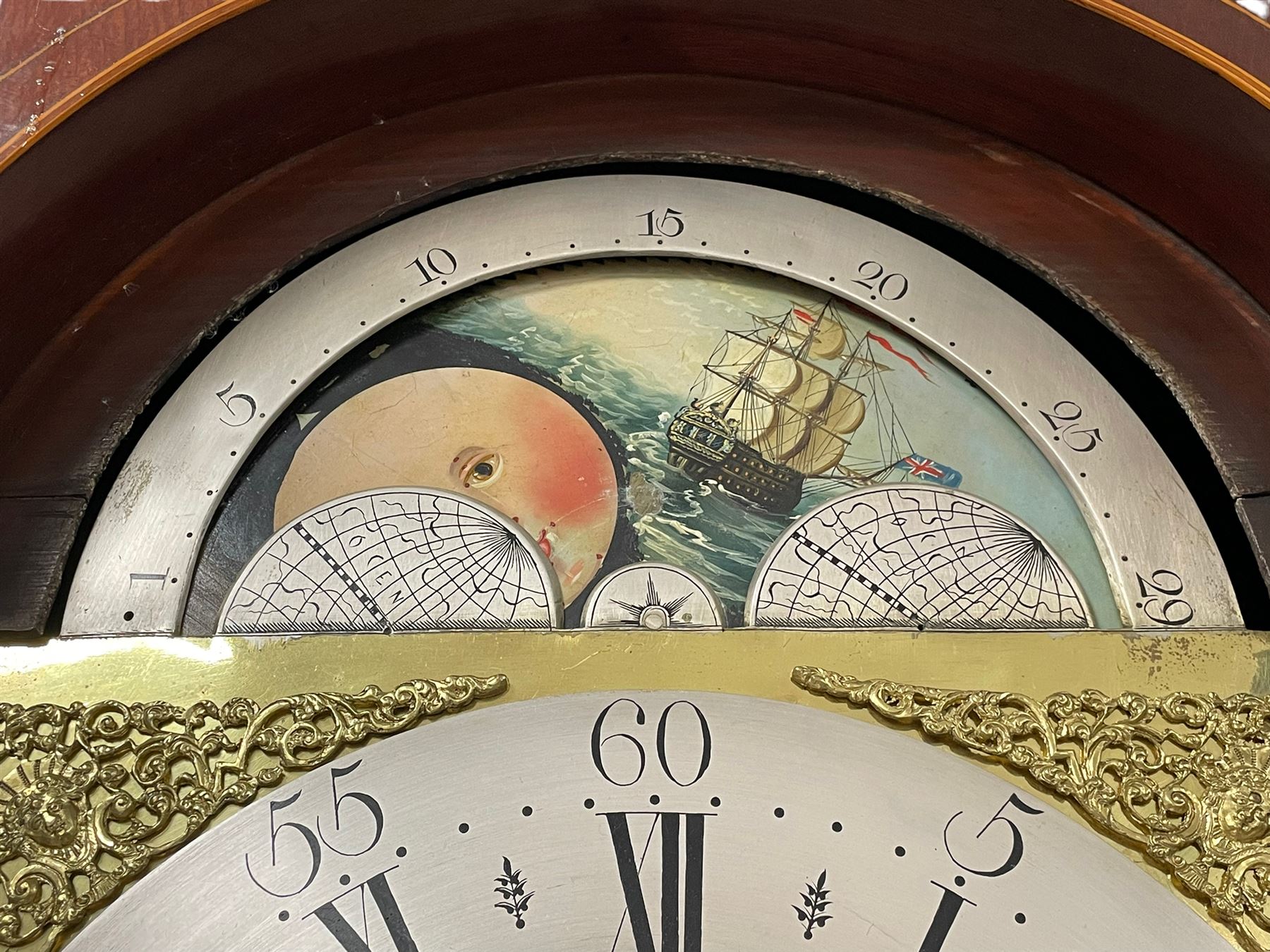 Pattison of Halifax - Late 18th century mahogany 8-day longcase clock, With a swans necked pediment and brass patera, recessed break arch hood door beneath flanked by plain turned pilasters with brass capitals, trunk with satinwood inlay, reeded columns and a curved top door with an ivory escutcheon, conforming plinth raised on bracket feet, brass dial with a rolling moon to the arch, cast spandrels , engraved and silvered dial centre  and chapter ring, chapter with Roman numerals, five minute Arabic's and minute markers, makers name to the dial centre with seconds and date work, dial pinned to a rack striking movement, striking the hours on a cast bell. With weights and pendulum. John Pattison is recorded as working in Halifax c1783.   

This item has been registered for sale under Section 10 of the APHA Ivory Act