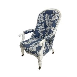 Victorian white painted open armchair, upholstered in blue fabric decorated with trailing leaf pattern, scrolled arm terminals on turned front supports with castors