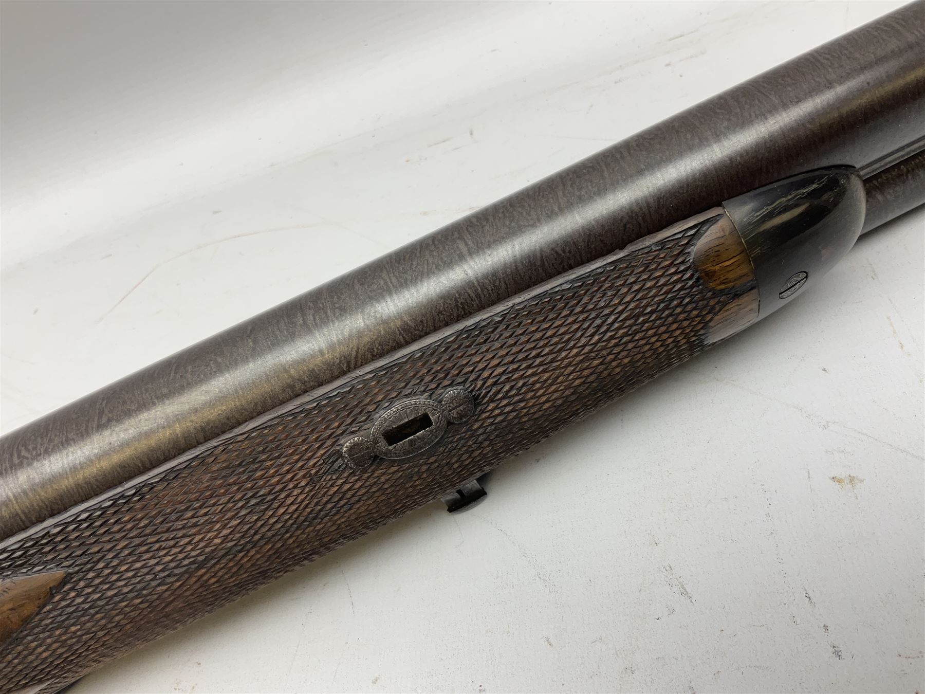 19th century John Jefferson of Scarborough 6-bore (modern 4-bore) double barrel side-by-side percussion gun, with 81cm stub twist damascus barrels (no provision for ramrod), well figured walnut stock with fine chequered grip and fore-end with horn tip and steel butt plate with long tang, well engraved lock and hammers with half-cock safeties on both sides, barrel sling swivel but rear sling swivel removed and replaced with silver escutcheon, London proofmarks, NVN, L128cm