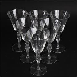 Set of six Murano clear glass wine glasses, each with part moulded fluted flared bowl, upon a knopped and fluted baluster stem and spreading circular foot, with etched marks beneath, H19.5cm