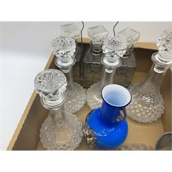 Assorted glassware, to include set of three decanters with labels in stand, metal mounted claret jug, drinking glasses, of various size and form, etc., in two boxes 
