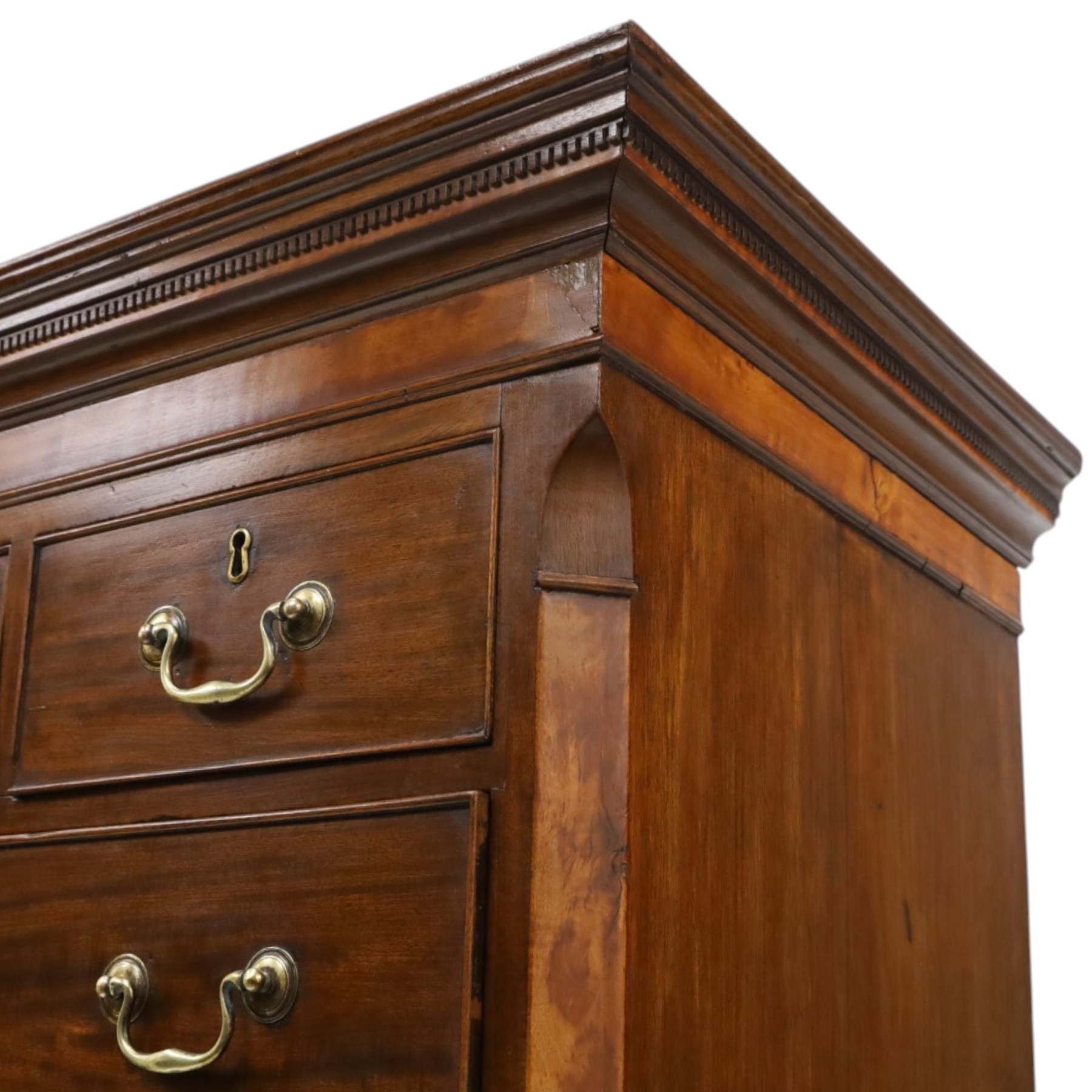 Late 18th century George III mahogany secretaire chest-on-chest, dentil cornice over banded frieze, the top section fitted with three short cock-beaded drawers over three long flanked by chamfered uprights, the base with initial secretaire drawer - fall-front enclosing fitted interior with button-release, correspondence drawers and pigeonholes, over two long drawers with brass swan-neck handles and bracket feet