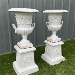 Pair of Victorian cast iron white painted urns on plinths - THIS LOT IS TO BE COLLECTED BY APPOINTMENT FROM DUGGLEBY STORAGE, GREAT HILL, EASTFIELD, SCARBOROUGH, YO11 3TX