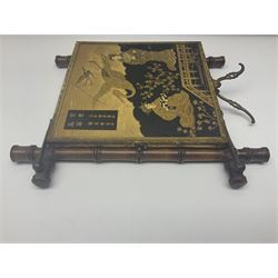 Japaneses triptych mirror, with two fold out panels with prints depicting egrets and figures in a garden with Japanese text, within a bamboo frame, H32cm