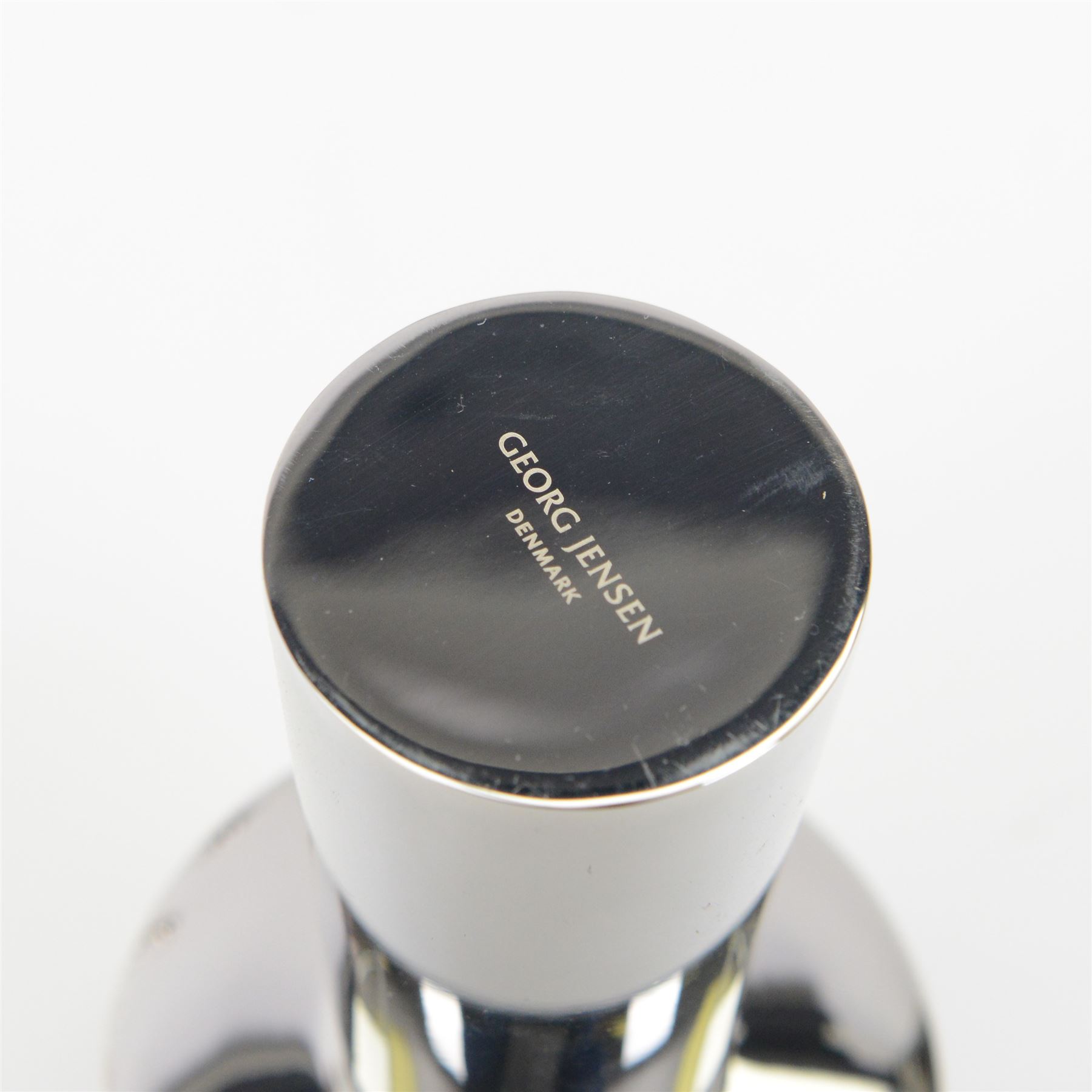 Georg Jensen set of three stainless steel candlesticks, designed by Rebecca Uth, together with another candlestick designed by Constantin Wortmann, both in original boxes   