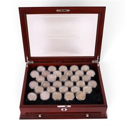 Thirty-two United States of America silver one dollar coins, comprising twenty-three 'Morgan' dollars and nine 'Peace' dollars, presented as 'The Complete Morgan and Peace Silver Dollar Collection', in display case