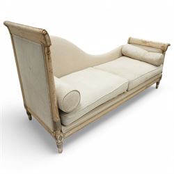 19th Century French day bed, the shaped back and scroll ends with fluted supports and carved rosettes, upholstered in natural linen with loose seat cushions and bolster pillows