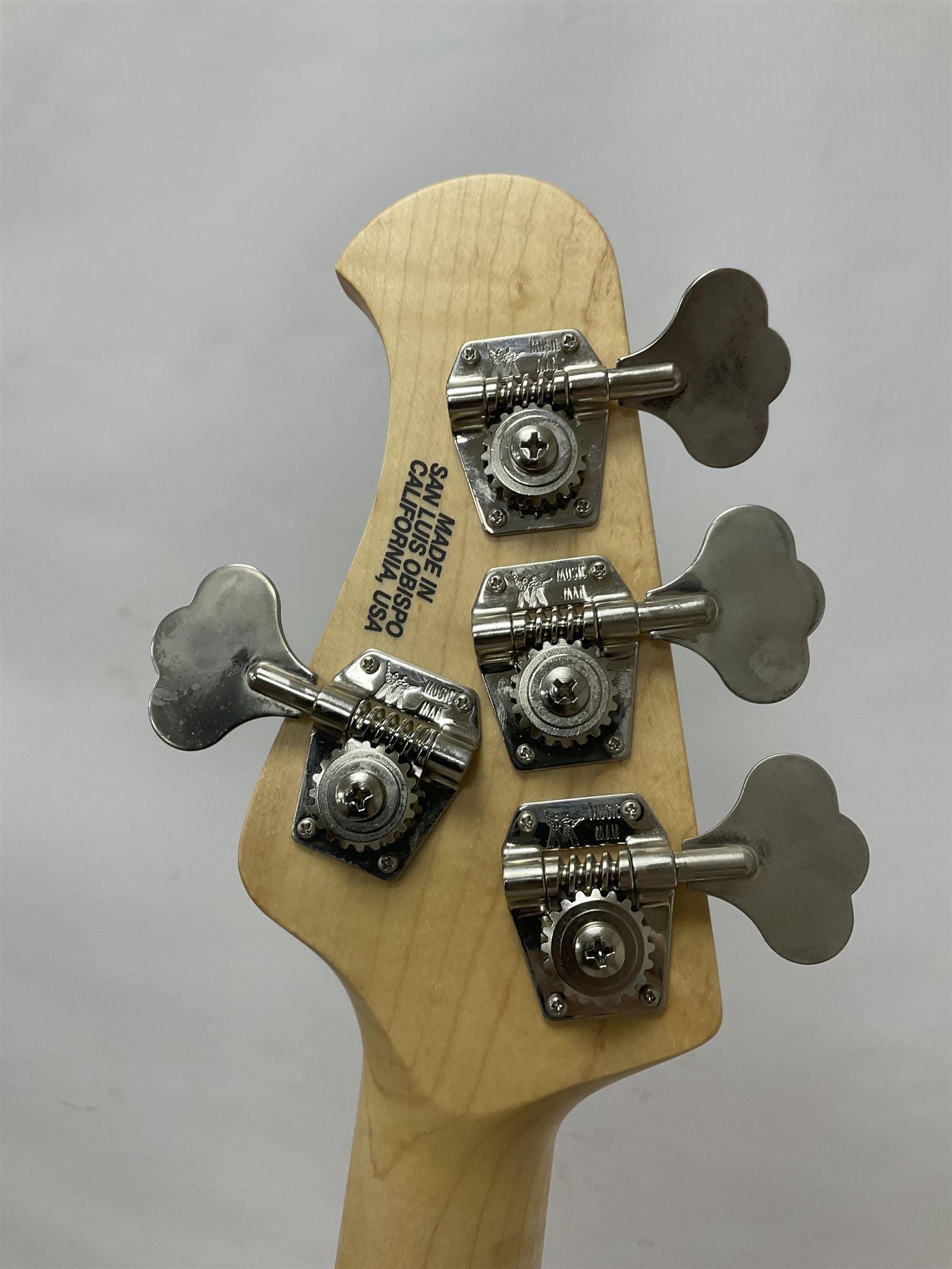 Ernie Ball Music Man Sting Ray 4 string bass guitar, in natural finish with roasted maple neck and tortoiseshell effect scratch guard, serial no 87485, in black Music Man hard case, guitar L114cm