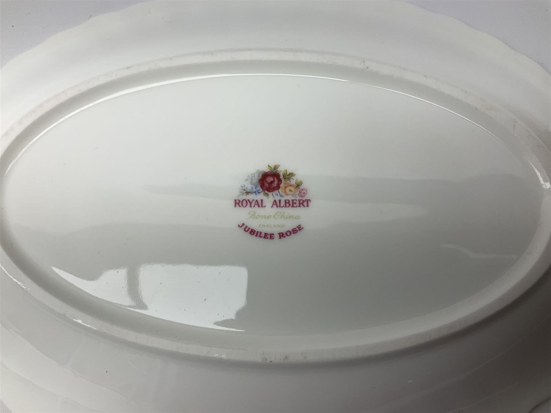 Royal Albert Old Country Roses pattern tea set, comprising teapot, coffee pot, six teacups and six saucers, five side plates, further teacup with joined saucer and side plate, open sucrier, milk jug, cake plate, and preserve pot and cover, together with Royal Albert Jubilee Rose pattern sauce boat and stand, and Royal Albert Lavender Rose pattern cake stand. 