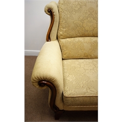  Three seat sofa upholstered in pale gold fabric with mahogany facias (W210cm) and matching two seater  