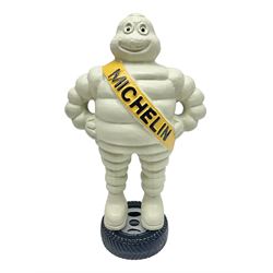 Cast iron figure of Michelin Man, stood on a tyre, H34cm 