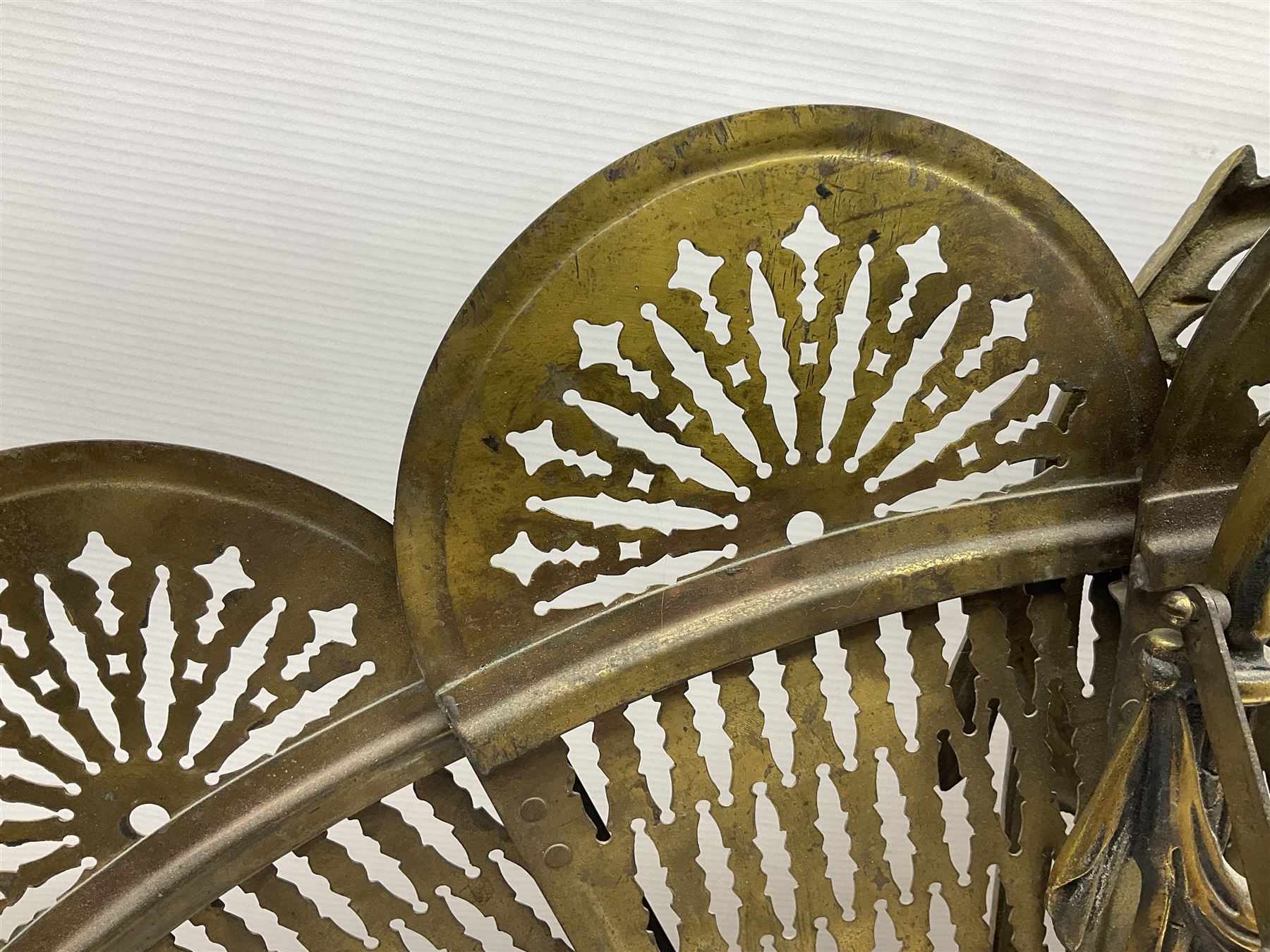 Pierced brass peacock style folding fire screen, with urn finial, H65.5cm