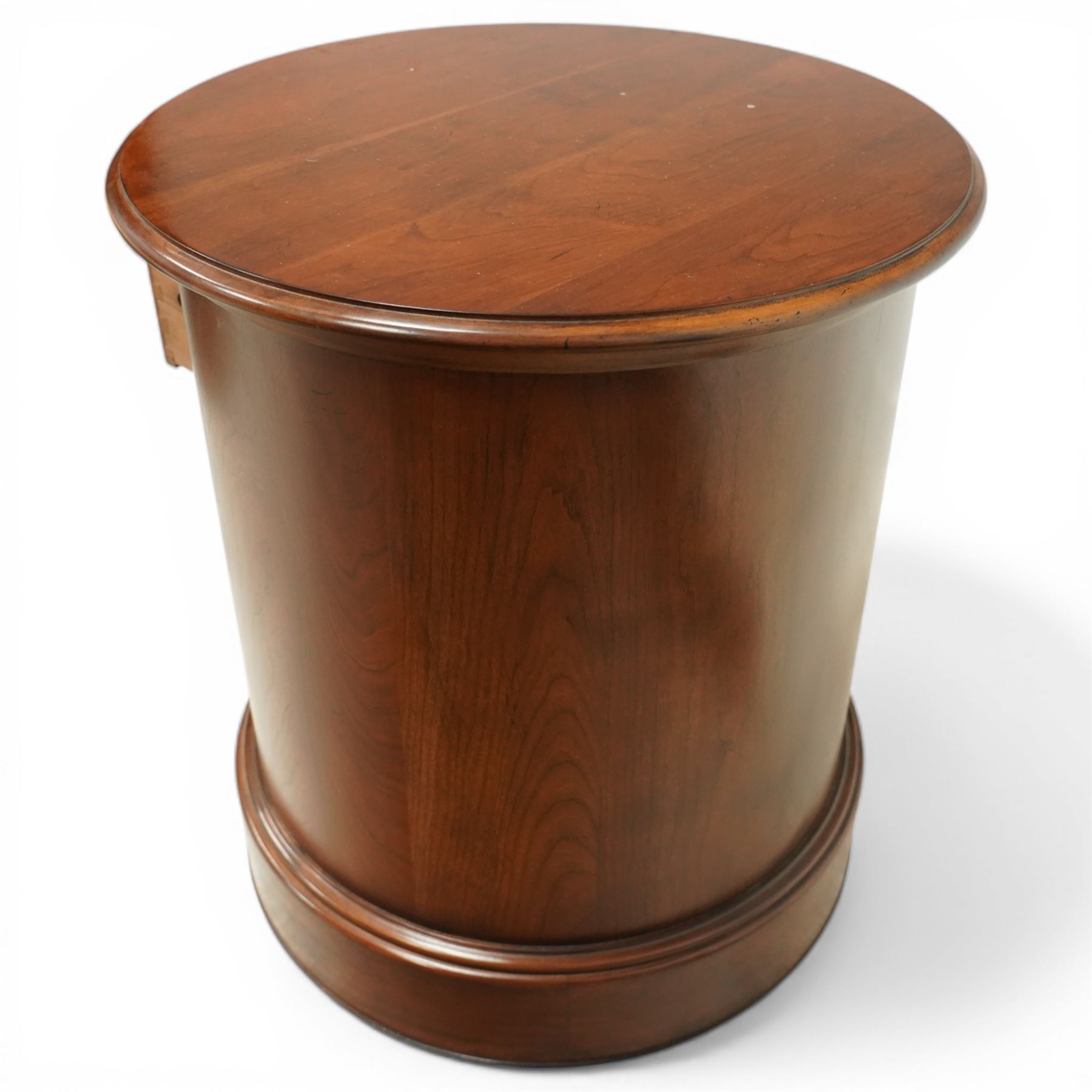 Willis & Gambier - circular chest, three drawers with brass pulls on a moulded 
