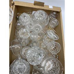 A group of assorted Victorian and later glassware, comprising largely cut glass, to include various bowls, lidded jars, candlesticks, vases, etc. 
