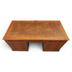 Georgian design yew wood twin pedestal office desk, the top featuring an inset leather writing surface, with drawer drawers and centre keyboard slide, all above two cupboards with slide out shelves