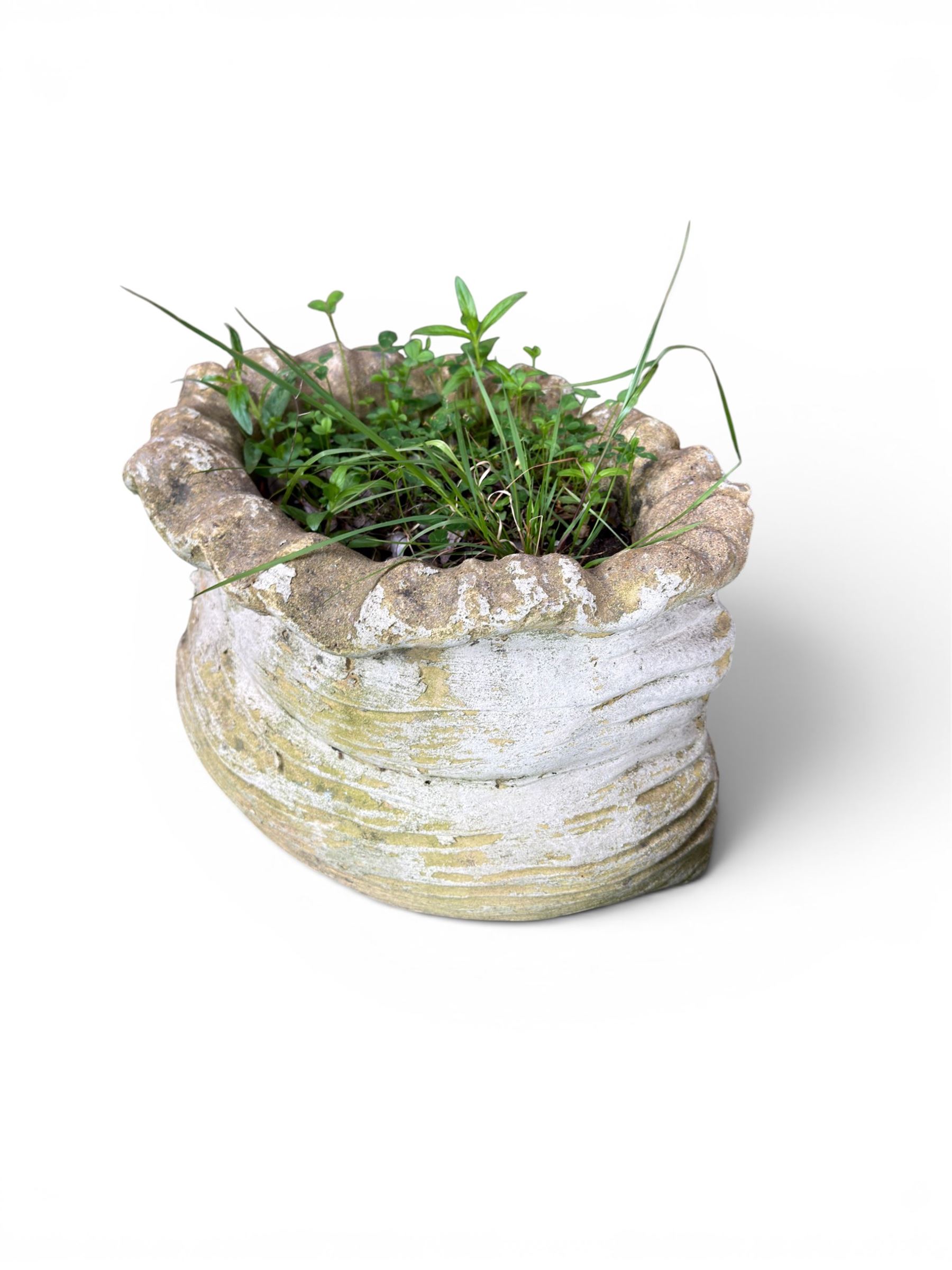 Four cast stone garden planters in the form of ribbon tied planting sacks