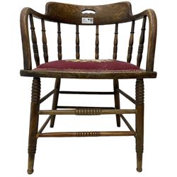 Early 20th century American oak smokers bow tub armchair, shaped cresting rail with pierced handle over ring turned spindle back, seat upholstered in pink tapestry fabric (W56cm, H73cm); small 20th century walnut occasional table on turned supports (W43cm, H70cm, D33cm)