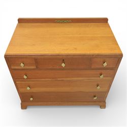 Early 20th century Art Deco bedroom suite, comprising double wardrobe, dressing table and chest of drawers, constructed in walnut with figured veneers and geometric banding, the wardrobe with arched top and panelled doors enclosing a fitted interior, the dressing table with rectangular top below a three panel mirror arrangement, fitted with two short over two long drawers, the chest with three short and three long drawers, each piece fitted with faceted handles and raised on shaped feet
Wardrobe (H 177cm, D 46cm, W 112cm)
Chest (H 85cm, D 48cm, W 92cm)
Dressing table (H 160cm, D 52cm, W 106cm)
