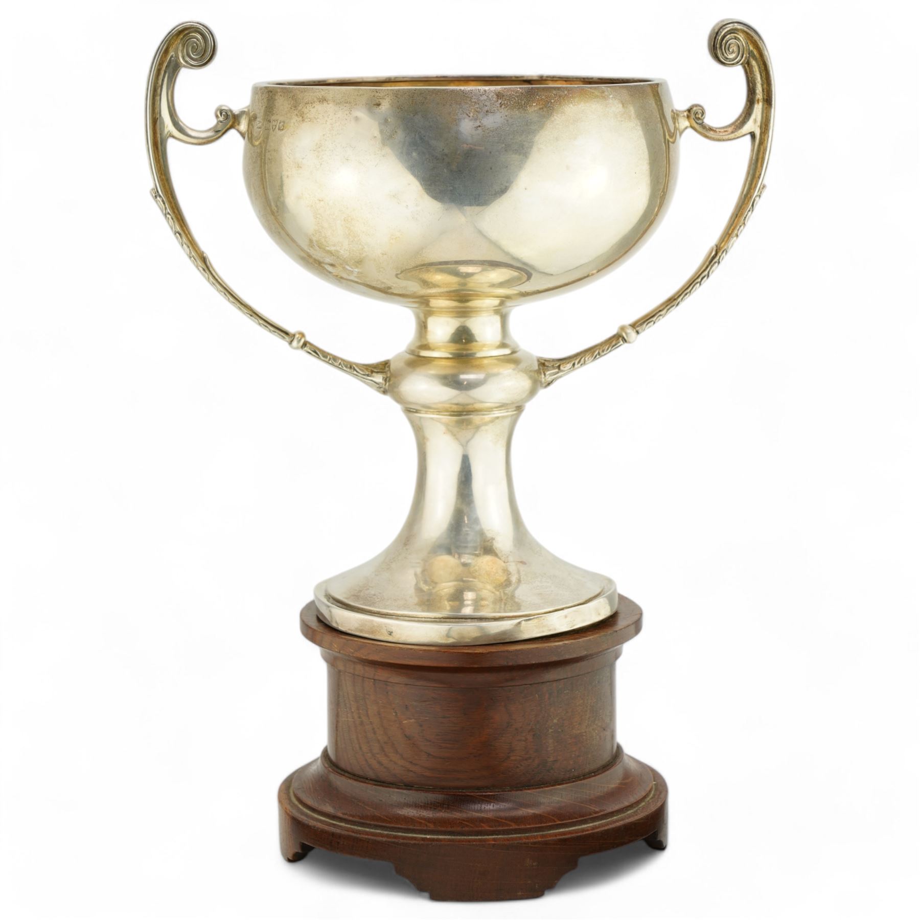 'The Harry Preston Memorial Challenge Cup 1929' - A two handled cup on pedestal base and wooden plinth marked Elkington & Co. H37cm overall Chester 1929 Maker Fattorini & Son