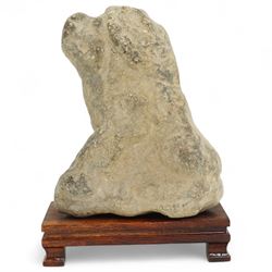 Chinese Western Han Dynasty (206BC–24AD) carved seated stone dog, stylized figure with upright ears and upraised squared snout, grey stone with weathered surface and tool marks visible to underside W13cm H16.5cm