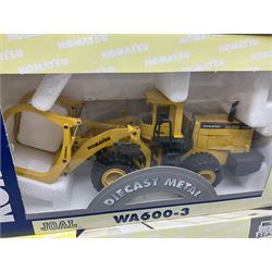 Four Joal Komatsu 1:50 scale die-cast models comprising WA600-3 Log Loader, HD605-5 Dump Truck and two PC1100LC-6 Material Handler, together with a CAT Articulate Truck, all boxed (5)