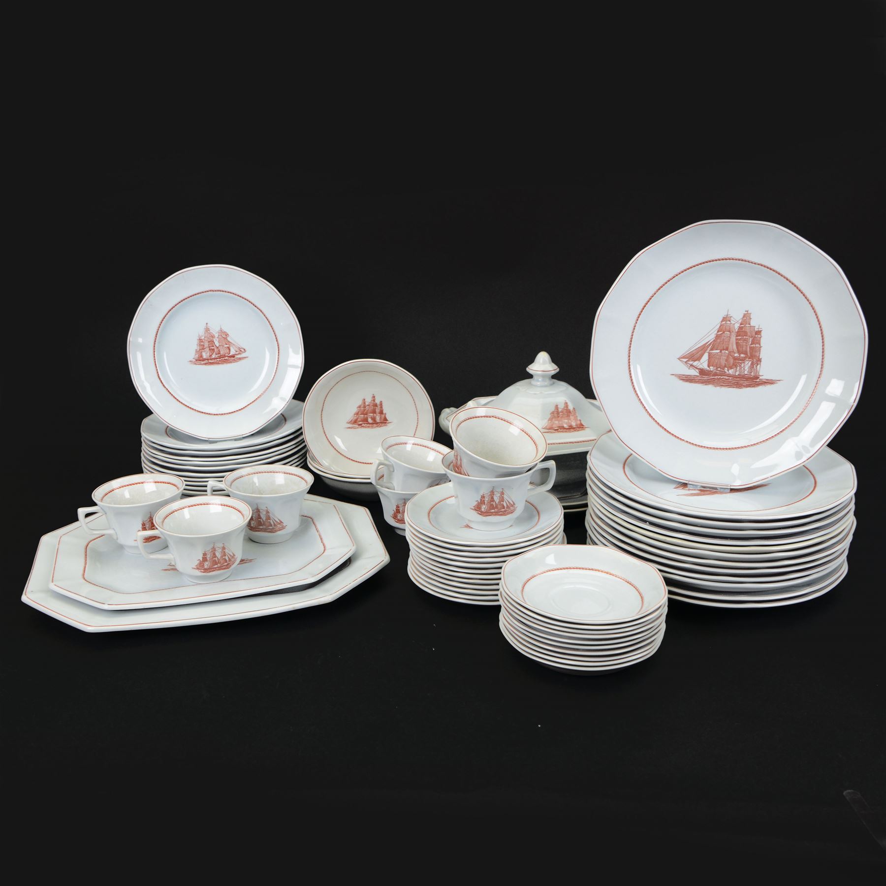Wedgwood Flying Cloud Georgetown collection tea and dinner wares, including tureen, seven teacups, ten saucers, twelve side plates, three small bowls, two platters, thirteen dinner plates, etc, all decorated with red clipper ship and with printed marks beneath