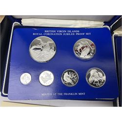 Four British Virgin Islands proof coin sets, comprising First Coinage of the British Virgin Islands 1973 proof six coin set, containing silver one dollar coin, 1977 and 1979 proof sets, containing high denomination silver coins, and The Royal Coronation Jubilee 1977 six coin silver proof set, each minted at the Franklin Mint, all cased with certificates, and a Solomon Islands 1978 proof seven coin set, containing silver five dollar coin, minted at the Franklin Mint, cased with certificate (5)