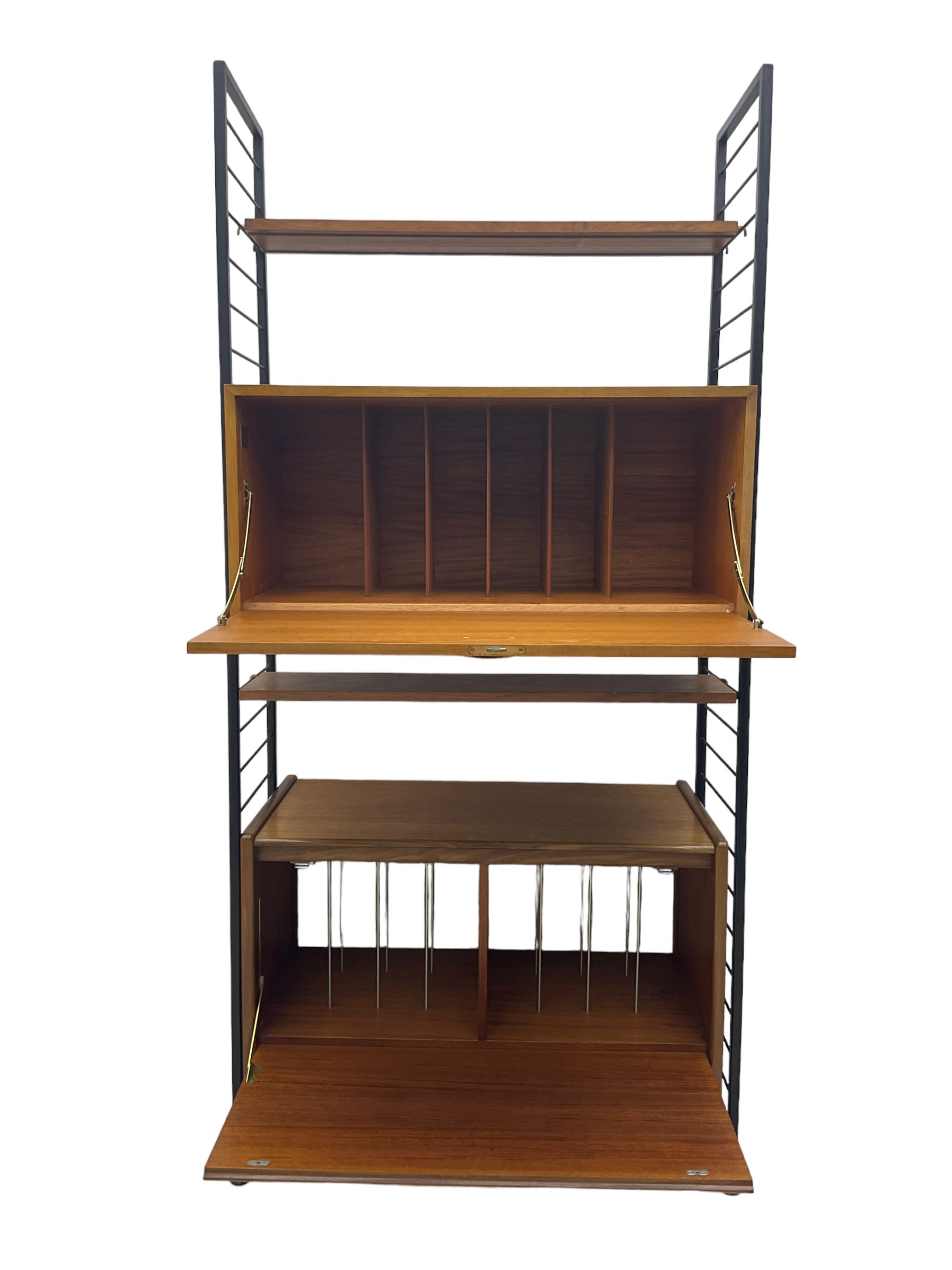 Staples Ladderax - mid-20th century teak and metal framed modular wall unit, fitted with central fall-front cupboard enclosing correspondence dividers, over secondary separate teak fall-front cupboard, adjustable shelf to top