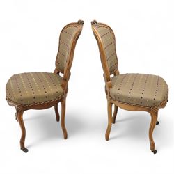 Set of four Victorian walnut framed salon chairs, upholstered in olive fabric with diamond embossed tufts