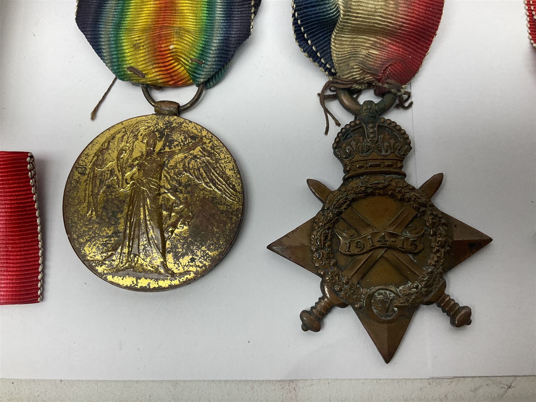 WWI pair of medals comprising British War Medal and Victory Medal awarded to 32682 Pte. W. Meadows W. Rid. R. in issue box; WWI pair of medals comprising 1914-15 Star and Victory Medal awarded to 3720 Pte. (later Cpl.) E. Petty W. York. R. with issue letter from Tank Corps; WWII group of five medals comprising 1939-45 War Medal, Defence Medal and 1939-45, Italy and Africa Stars; all with ribbons; and book of nineteen seaman's Certificates of Discharge to cook Charles Filburn 1893 - 1901 from various British ports