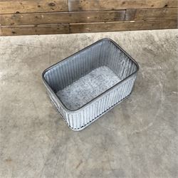 Set of three pressed metal planters in different sizes