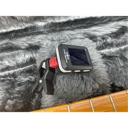 Copy of a Fender Stratocaster electric guitar in black with Wilkinson bridge, lock-in tuners, synchronised tremolo and various patent numbers; L99cm; in hard carrying case with strap and digital tuner