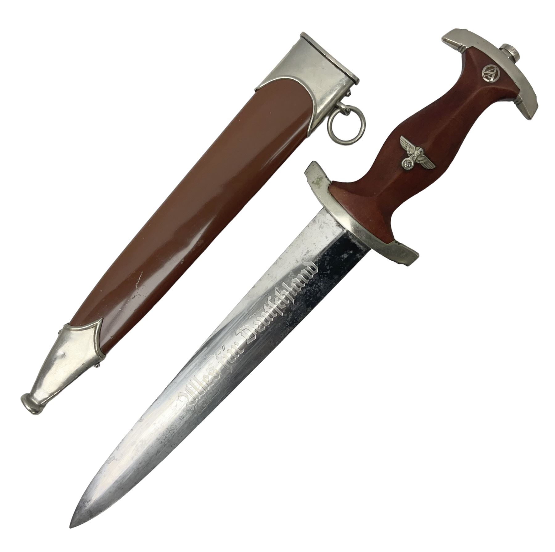WW2 German SA dagger the 22cm double edged steel blade by G. Felix Gloriawerk Solingen inscribed 'Alles Fur Deutschland', the cross-piece impressed with the SA Gruppen mark Nm verso for Nordmark, wooden grip inset with eagle and SA emblem; in brown painted scabbard with nickel mounts L37cm overall